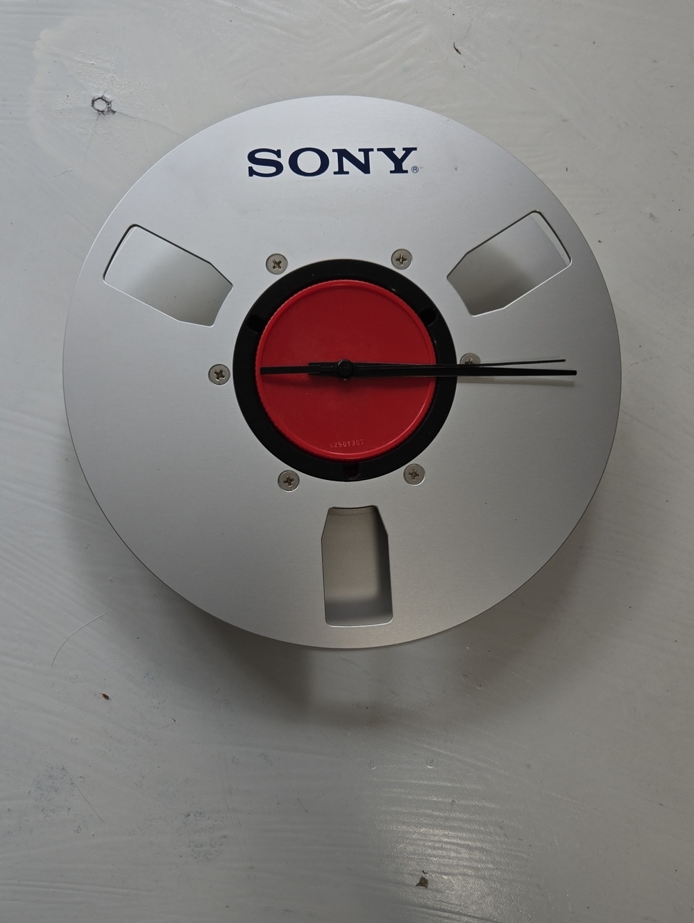 Sony Silver and Red Reel-Style Wall Clock